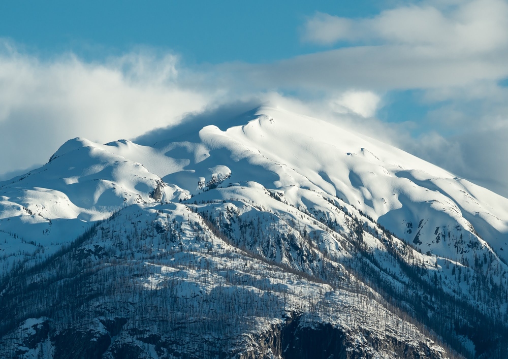 a mountain with a snowy peak