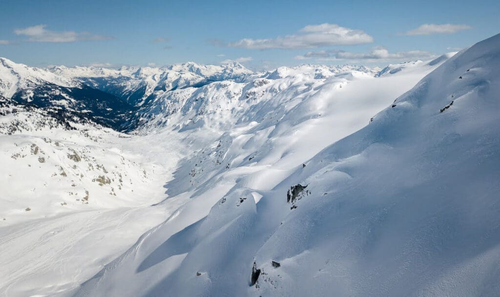 A view looking north from the Rutherford glacier valley in the spring with snow on teh peaks and in the valley.
