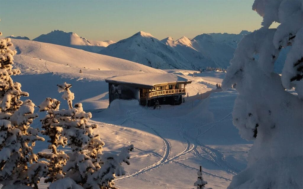 looking at the Kees and Claire hut in winter with the fading light of the day.