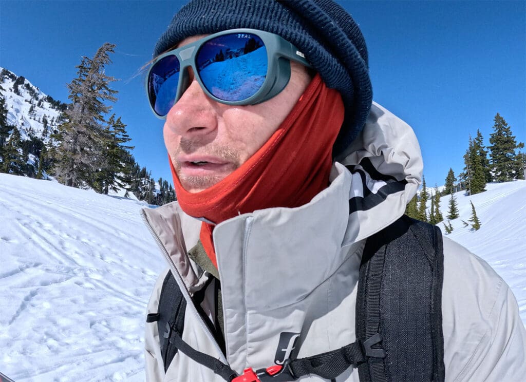 a snowboarder hikes wearing a snowboarding jacket from Forum