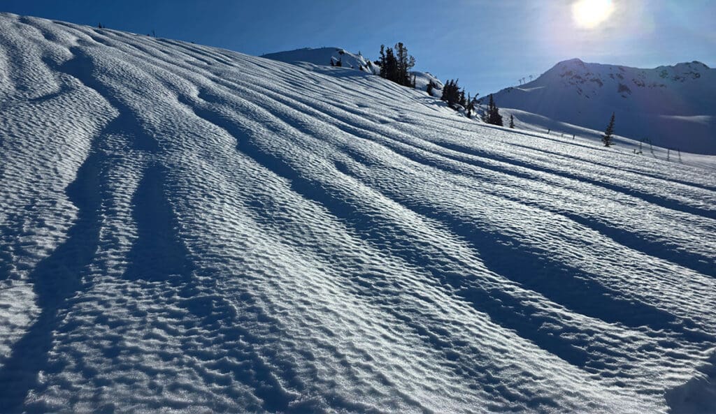 a combination of rain runnels and sun cups after a massive rain event on whistler mountain in 2026