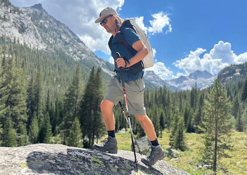 a hiker moves through a subalpine valley in the Sawtooth Mountains