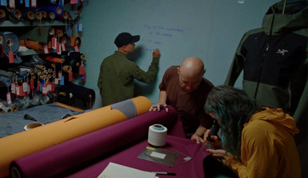 the design team at arc'teryx making plans in their headquarters on their new sperro sv jacket