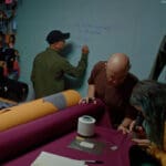 the design team at arc'teryx making plans in their headquarters on their new sperro sv jacket