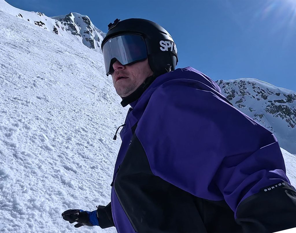 a snowboarder rides in the alpine from the peak in Whistler, british columbia