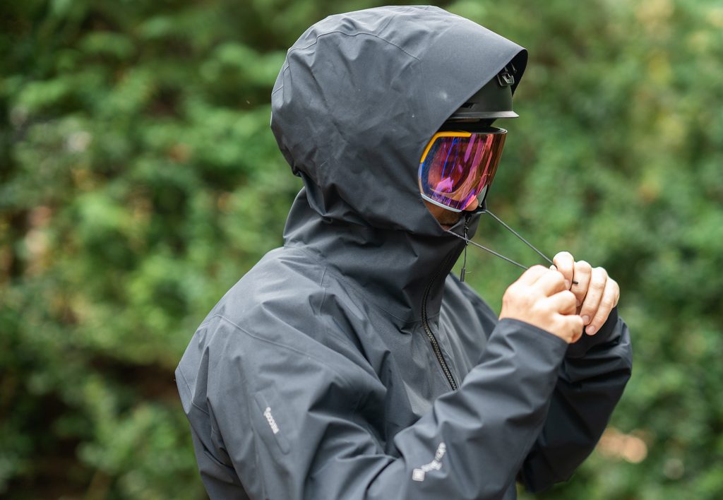 adjusting the hood cinch on the 7mesh guardian terra jacket