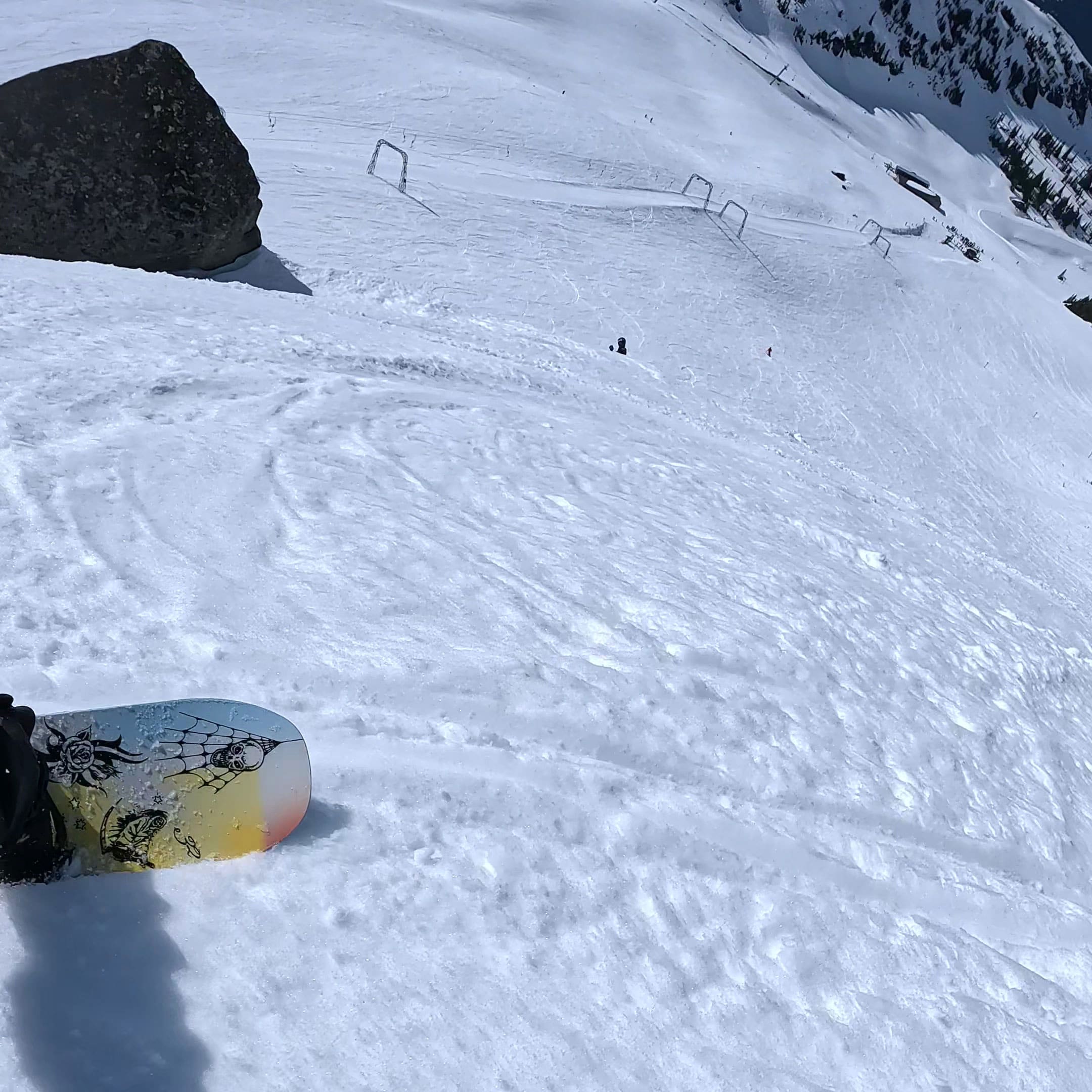 Snowboarder riding the ThirtyTwo Permanent Vacation snowboard at Whistler in spring conditions